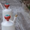 Tall strawberry jam pot with spoon